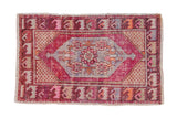 Faded fuchsia distressed Oushak rug, central beige medallion, floral and geometric motifs, 2'9
