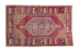 Distressed Oushak rug with floral medallion in magenta, pale blue, and beige tones, 2'9