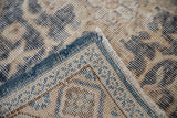 Detail of the hand-knotted foundation showing knot heads and the restored blue side cord selvage.