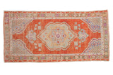 Vintage distressed Oushak runner with a rust medallion field, pale blue, and sea foam green accents.