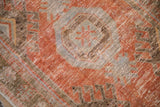 Distressed rust and pale blue geometric pattern with foundation showing on Oushak runner.