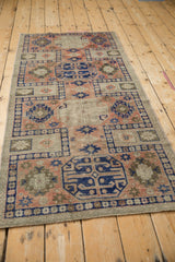 Distressed pile showing foundation, primitive geometric guls, blush, cobalt, and antique ivory.
