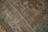 Vintage distressed Oushak rug runner pile, with low decorative texture in mauve, olive, and dusty blue tones.