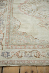 Distressed vintage Kayseri with silky ivory pile and pale pink floral scrolls.