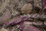 Textured vintage Oushak rug showing violet purple, beige, and chocolate brown distress.
