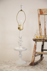 Chippy white painted base and lower floral elements of the Cambridge table lamp.