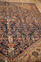 Antique Malayer rug's Herati pattern with foundation wear, showcasing navy, terracotta, and a stepped spandrel.