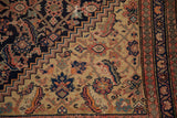 Navy Herati pattern meeting beige stepped spandrel on an antique Malayer rug.