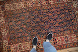 Antique Malayer rug detail: cobalt blue field, alternating boteh and germinating plant motifs.