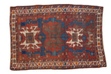 Vintage hand knotted Caucasian rug, geometric medallions in black cherry red, sapphire blue, ivory.