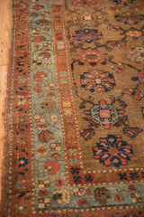 Antique Kurdish Hamadan rug detail with madder red border, powder blue abrashes, and floral field.
