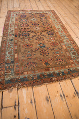 Antique Kurdish Hamadan rug with tattered fringe, indigo and madder root red floral border.