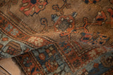 Antique Kurdish Hamadan rug texture revealing knot heads, muted blue abrashes, and floral motifs.