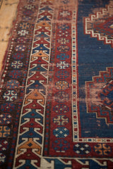 Antique Caucasian runner: hook and latch pattern, red, navy blue, ivory, threadbare pile.