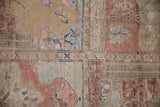Distressed beige, terracotta, and blue pictorial panel of a vintage Sivas rug.