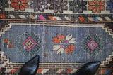 Textured distressed Oushak runner, faded blue field with tangerine and fuchsia geometric patterns.