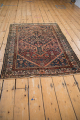 Herati pattern field with faded brick red, dusty sapphire blue tones.