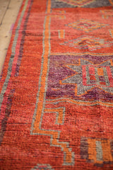 Vibrant distressed Kurd runner's abrashed orange and aubergine checkered diamond pattern.