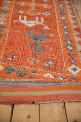 Visible hand-knotted pile of a distressed Kurd runner with playful figures in tangerine and platinum.