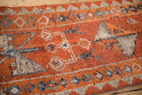Vintage distressed Kurd runner pile showing mostly even wear with tangerine and silver patterns.