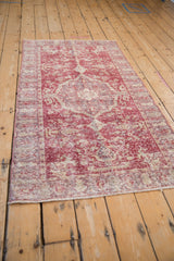 Textured vintage Distressed Sparta rug in faded raspberry, ivory, and subtle mauve.