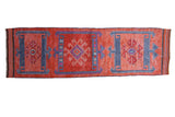 Distressed Kurd runner with triple geometric medallions, faded ruby red and royal blue. 3'9