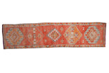 Distressed Kurd runner, oversized geometric medallions in faded tangerine, rust, silver. 2'9