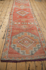 Geometric field of oversized medallions with textured faded rust and silver tones.
