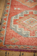 Vintage distressed Kurd runner with textured orange and oxidized silver zig-zag border.