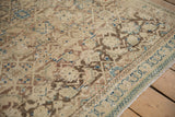 Distressed Hamadan rug showing worn knot heads, antique ivory, soft brown, and dusty blue.