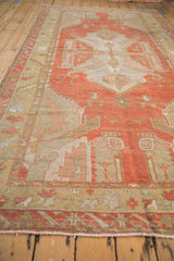 Distressed vintage Oushak rug border, serrated leaf and palmette motifs in faded rust, beige, silver.
