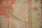 Distressed Oushak carpet, highlighting worn pile, serrated patterns, and faded rust, beige hues.
