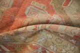 Vintage Distressed Oushak carpet pile showing faded pale rust, sand, and serrated motifs.