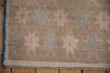 Distressed beige Oushak runner with pale blue starbursts, visible knot wear, blue selvage.