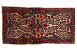 Antique transitional Mohajeran Sarouk runner: ivory floral field, ruby red, navy blue serpent borders.