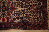 Transitional Mohajeran Sarouk rug's navy blue serpent border, ivory field, and ruby floral vinery.