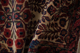 Close-up of transitional Antique Mohajeran Sarouk rug pile, ruby red florals on ivory ground.