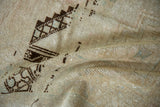 Soft wool texture of a distressed Oushak showing even wear to the knot heads.