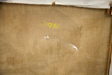 Back of painting's canvas, dated 11/30/58, showing rips and weathered texture.