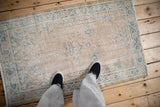 Vintage Distressed Sparta rug in dusty sand and pale blue, featuring a faded mehrab motif.