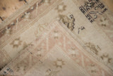 Textural view of distressed Oushak rug pile, hand-knotted foundation, and original side selvage.
