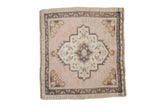 Vintage distressed Oushak square rug with a central medallion in dusty rose, ivory, and muted teal blue.