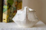 Gold stripe detail on the elegant handle of the vintage Homer Laughlin creamer.