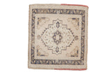 Vintage distressed Oushak square rug with a stepped medallion in ivory, dusty blue, and pale brown.