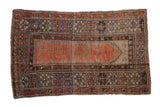 Distressed vintage Melas prayer rug, faded brick red field, blue and brown floral borders, 3' x 4'7