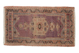 Distressed vintage Oushak rug with oversize aubergine and ivory medallion, meandering vine borders, 1'8