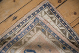 Folded corner of the Turkish Oushak rug showing its hand-knotted foundation and secured selvage edge.