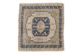 Vintage distressed Oushak square rug with dusty navy medallion and ivory, sand botanical field.