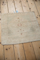 Vintage distressed Oushak rug center, with even wear to knot heads and faded copper motifs.