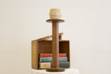 Large Akron industrial wooden spool with rustic dark patina and vintage look.